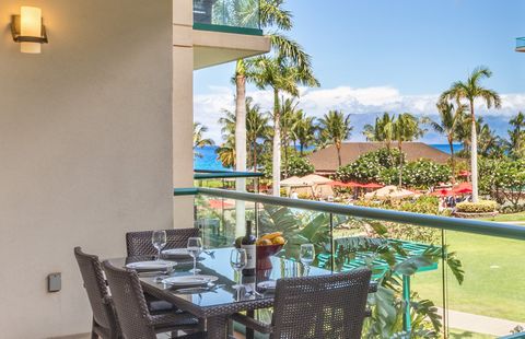 With lush courtyard, partial ocean, and dramatic Molokai views