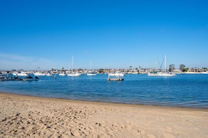 View of the bay beach in front of your rental. Watch the sailboats drift past or get lost in your favorite book.