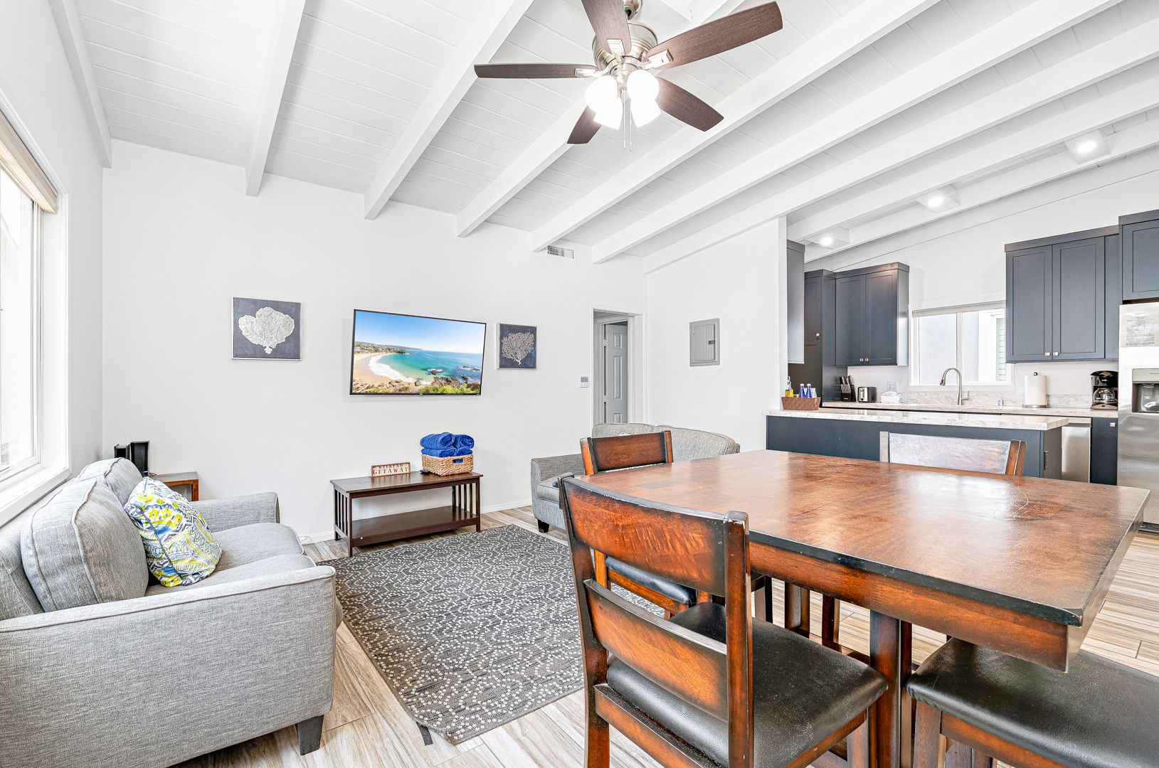 Living area includes 2 love seats, small dining table, and cable TV. Like most homes in the area, this unit does not include central air.
