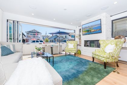 Spacious living and dining areas open up via disappearing sliders to the front patio of this high end, tri-level ocean view condo.
