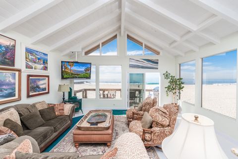 Showcasing uninterrupted views of Newport's white sand beaches and sparkling Pacific Ocean, this upper unit is perfect for families  looking to enjoy the beach on a budget.