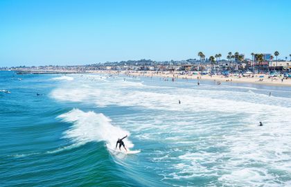 Surf rolling waves off Newport's coast, a favorite for year-round surf.