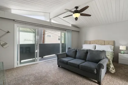 The tongue and groove wood ceiling and tasteful decor provide a beachy and relaxing ambiance.