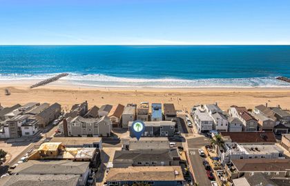 Aerial view showcasing the home’s prime location just two houses from the shoreline