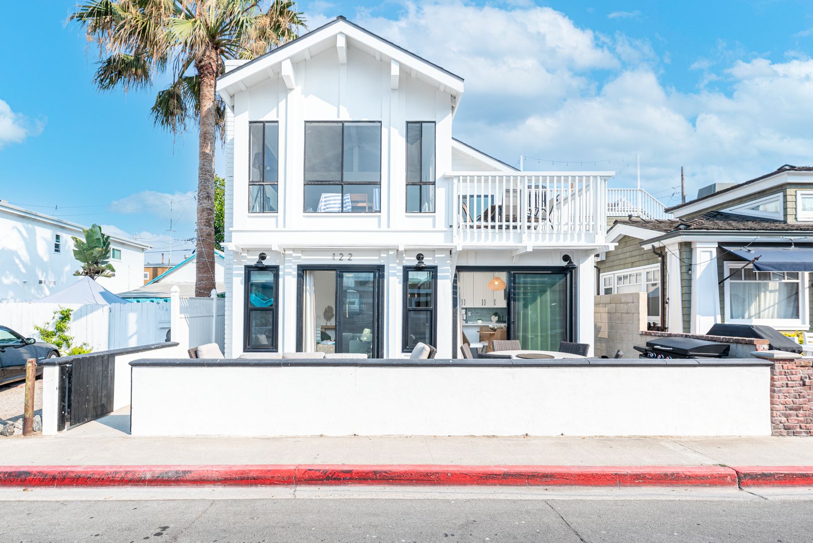 Enjoy exclusive access to this Newport Beach home, featuring both the ground-level and upper-level residences