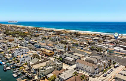 Sweeping aerial perspective showcasing the home’s incredible beachside setting on the Newport Beach Peninsula