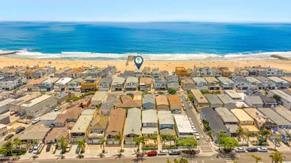 A bird’s-eye view of paradise, this home enjoys an oceanfront setting directly on the sands of Newport Beach