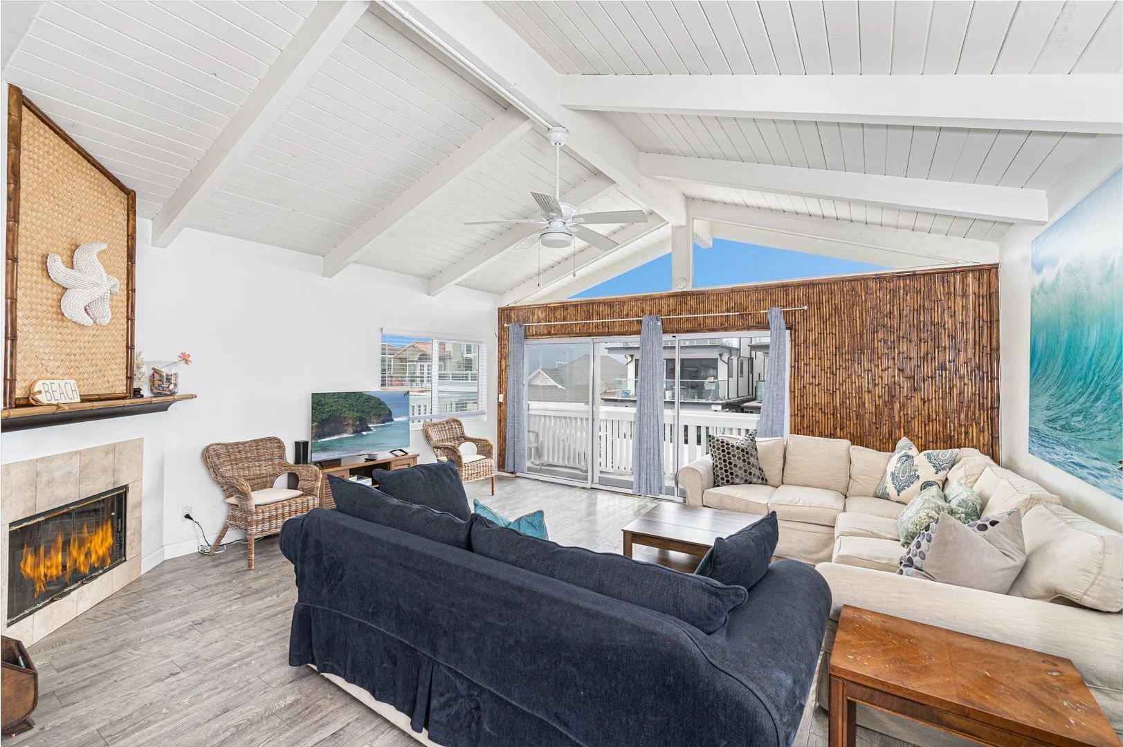 Spacious living areas open up to the front balcony of this upper 3 bd/2 ba ocean view unit.