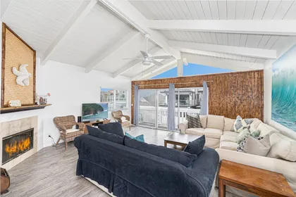 Spacious living areas open up to the front balcony of this upper 3 bd/2 ba ocean view unit.