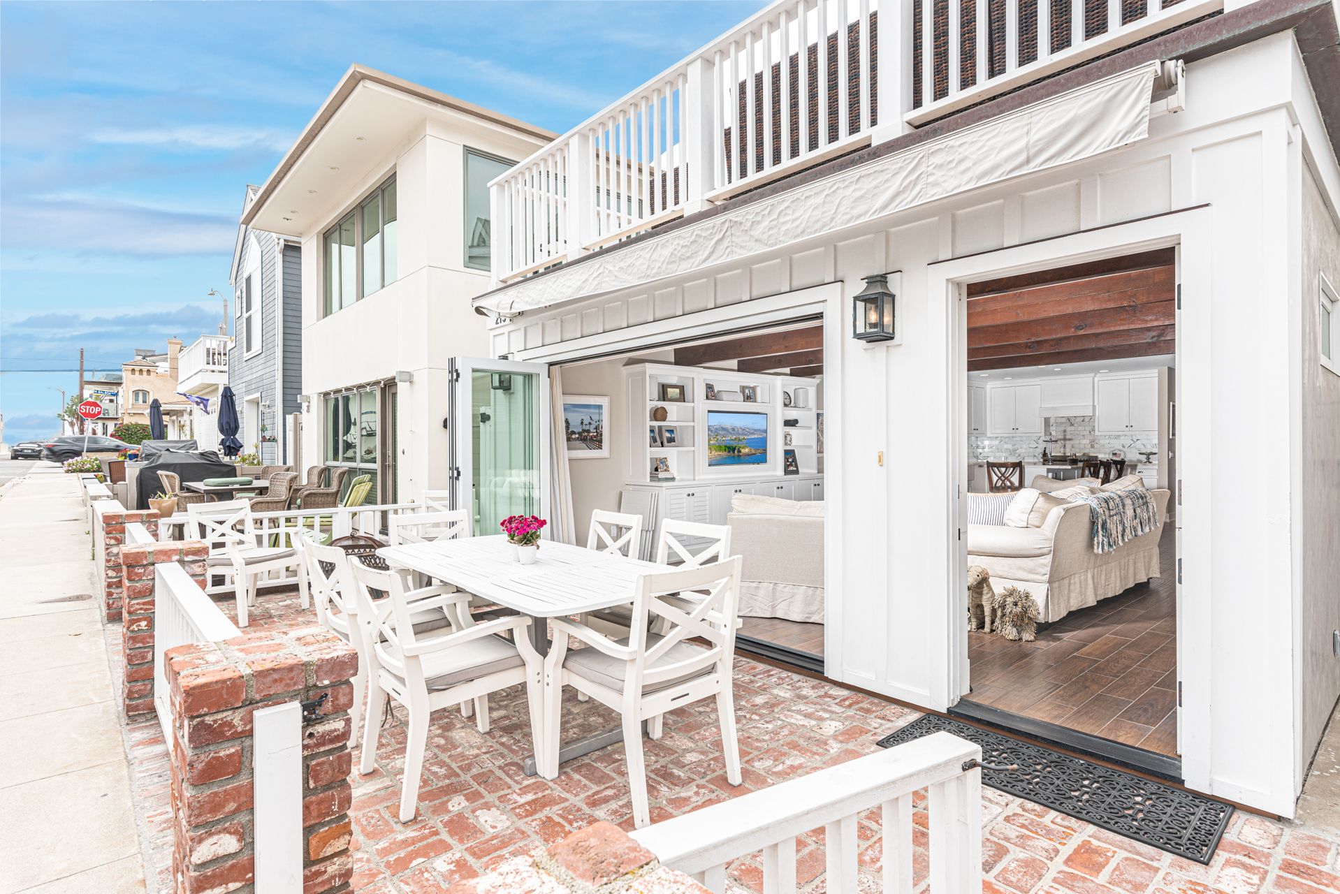 Bask in the sunshine all day long on the front patio, with dining table and only 2 short block from the beach.
