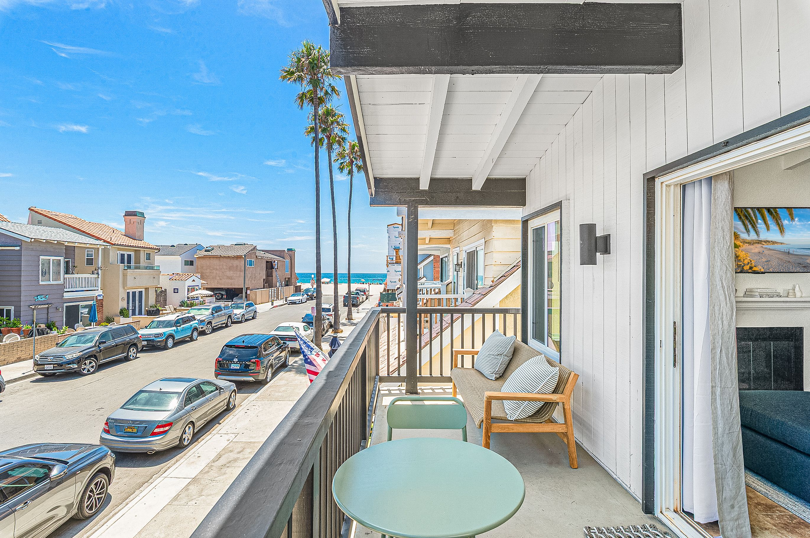 Front balcony with partial ocean views and coastal breezes