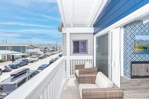 Sliding doors open out to the front deck to welcome in the ocean breeze.