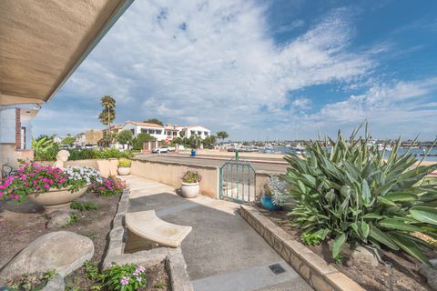 View of the front garden area and of the small, secluded bayfront beach beyond.