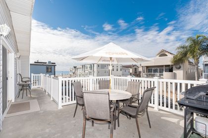 The ocean view front balcony includes chair seating and propane gas bbq grill, for morning coffee in the sunshine or evening cookouts as the sun sinks behind the horizon.