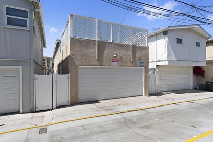 Rear alley access to the double garage affords two parking spaces for midsize or standard size vehicles. General neighborhood street parking (metered or unmetered) also in area.