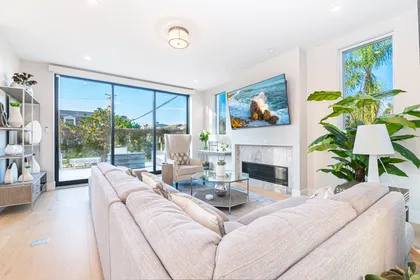 The living room seamlessly opens to the front patio for that wonderful indoor/outdoor lifestyle