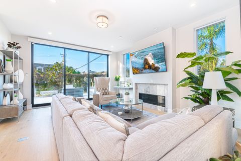The living room seamlessly opens to the front patio for that wonderful indoor/outdoor lifestyle