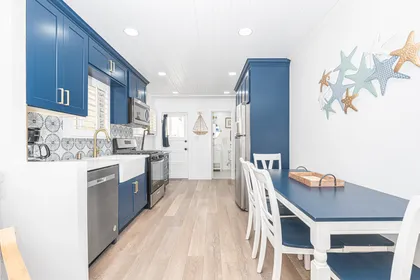 The main living area has everything you need for a getaway - dining area with seating for 6, a queen pullout sofa for extra sleeping accommodations, and TV.