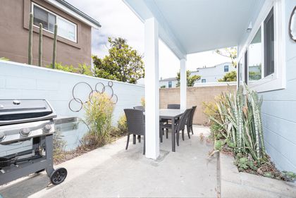 On the ground floor, you have access to a private patio with a propane BBQ grill and seating for four.