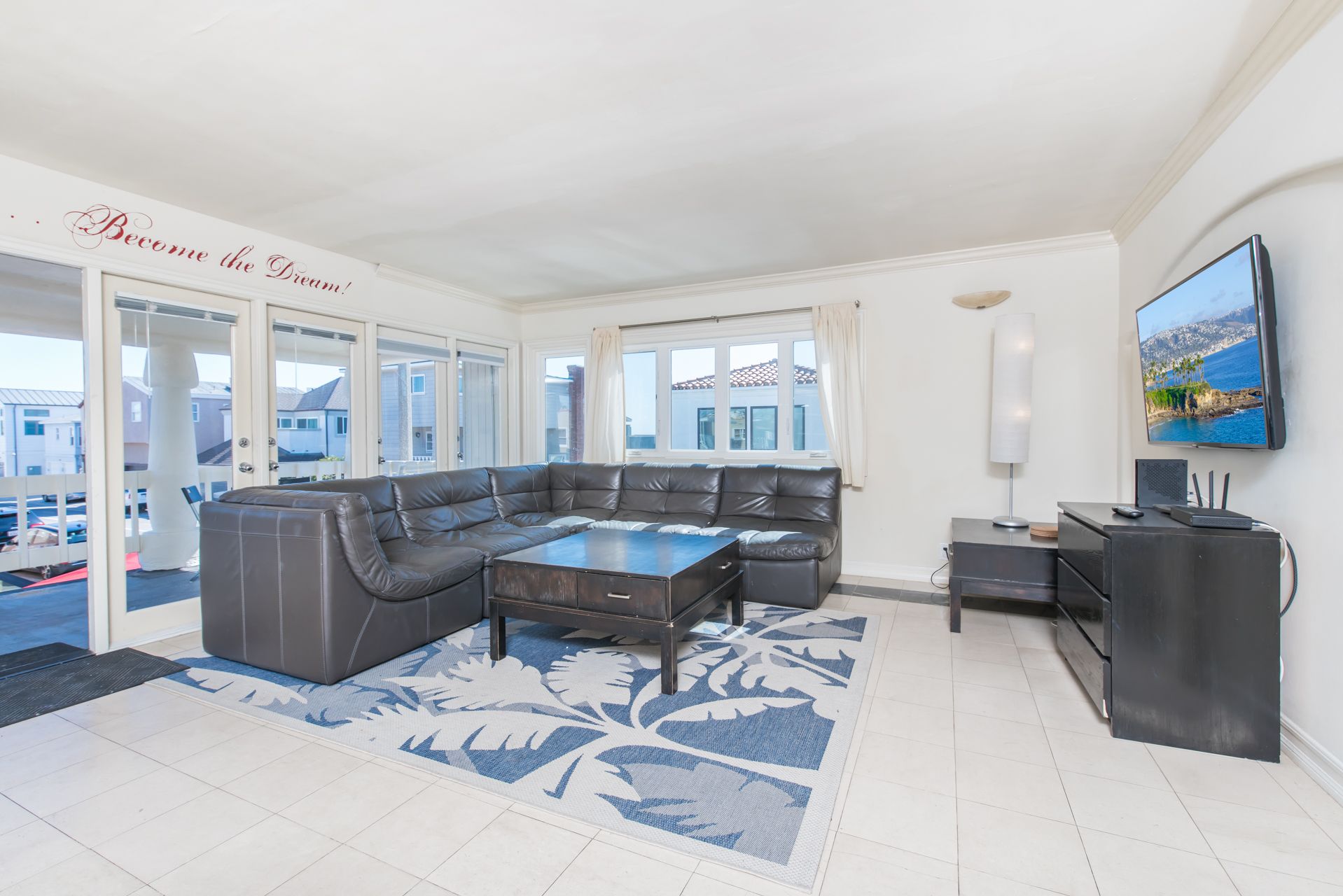 Spacious living and dining areas open up to the front balcony of this upper 4 bd/2 ba ocean view unit.