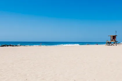 The view of the beach in front of your rental: soft sand and plenty of ocean fun!