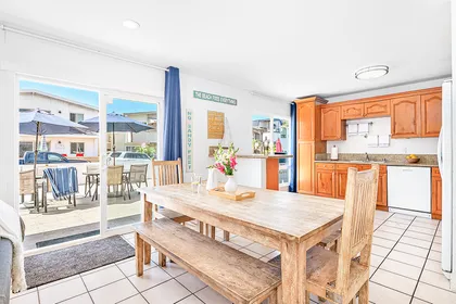 The kitchen opens out to the dining area, making meal prep a social affair