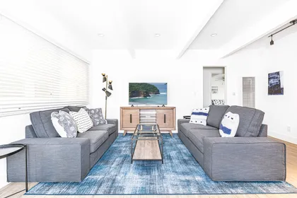 Enjoy a refreshing beach getaway in this classic Newport Beach cottage, just one house from the sand!