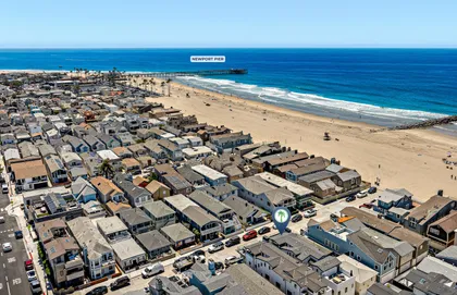 Sweeping aerial view of the beach and neighborhood just steps from the ocean