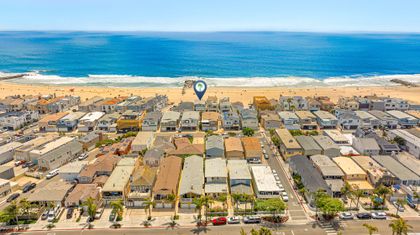 Front-row coastal living at its finest, this drone view captures the home’s unmatched position directly on the sand