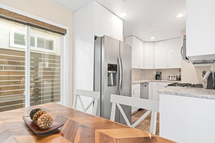 The dining table seats four and opens up to the fully-stocked kitchen.