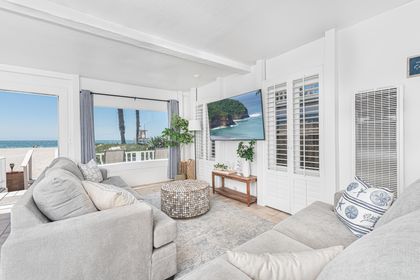 A living room with a beachfront view is where you can unwind while still enjoying the view of the ocean.