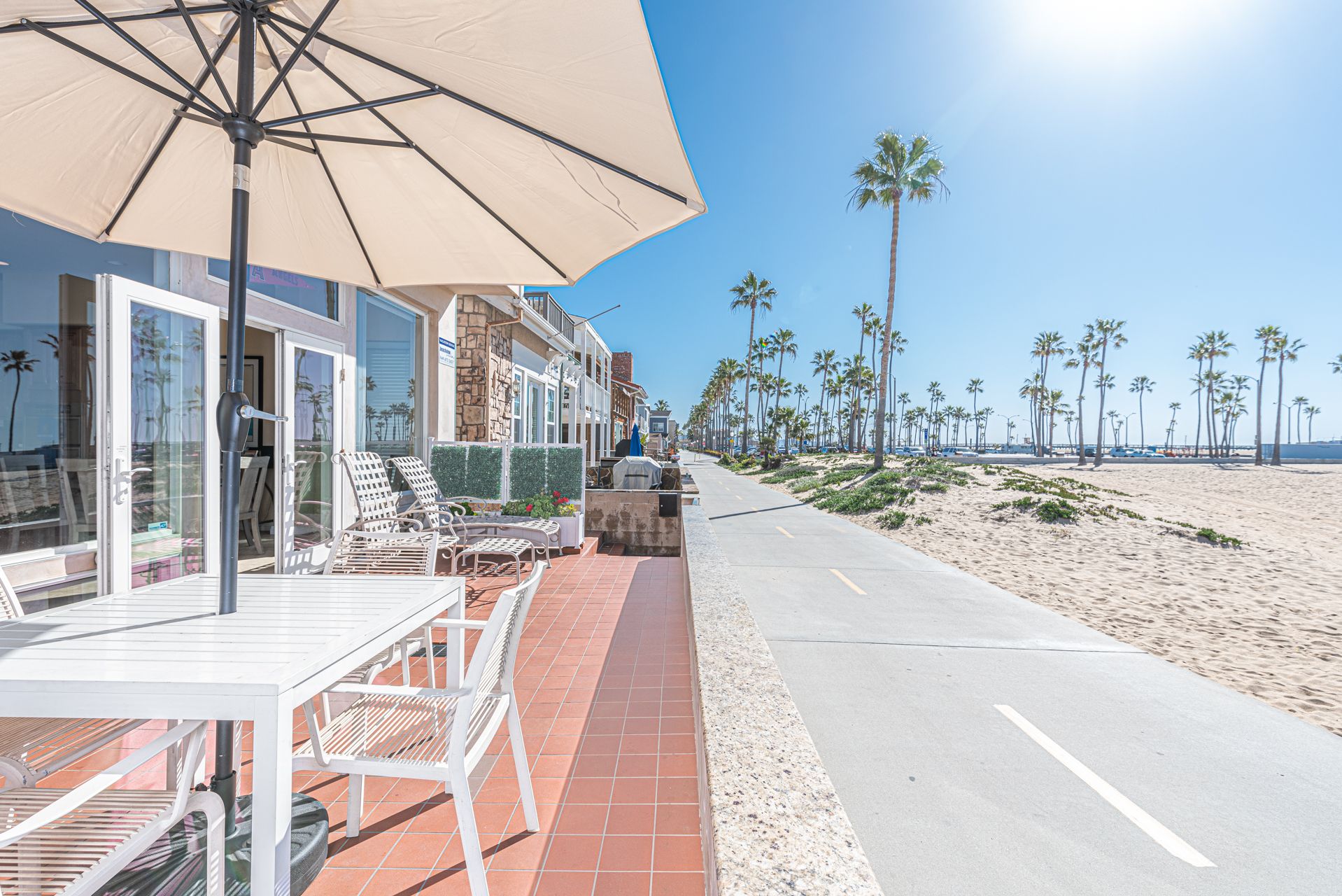 The pedestrian bike path is the only thing between you and the beach.