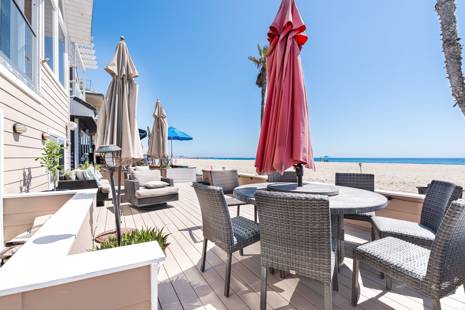 Dine outside on you oceanfront patio, with a spacious table for 6–7 and lounge seating