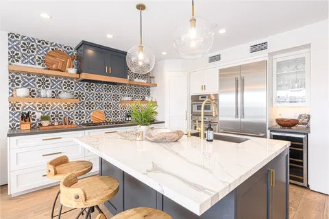 Gather around the expansive island for wine, conversation, and effortless entertaining