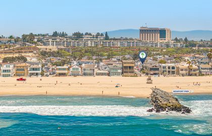 Drone perspective showcasing how effortlessly close this home is to 44th Street Beach