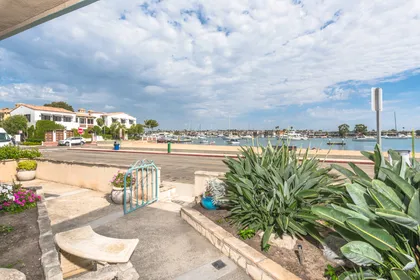 Unwind on one of three outdoor living spaces and watch sailboats glide across the peaceful bay