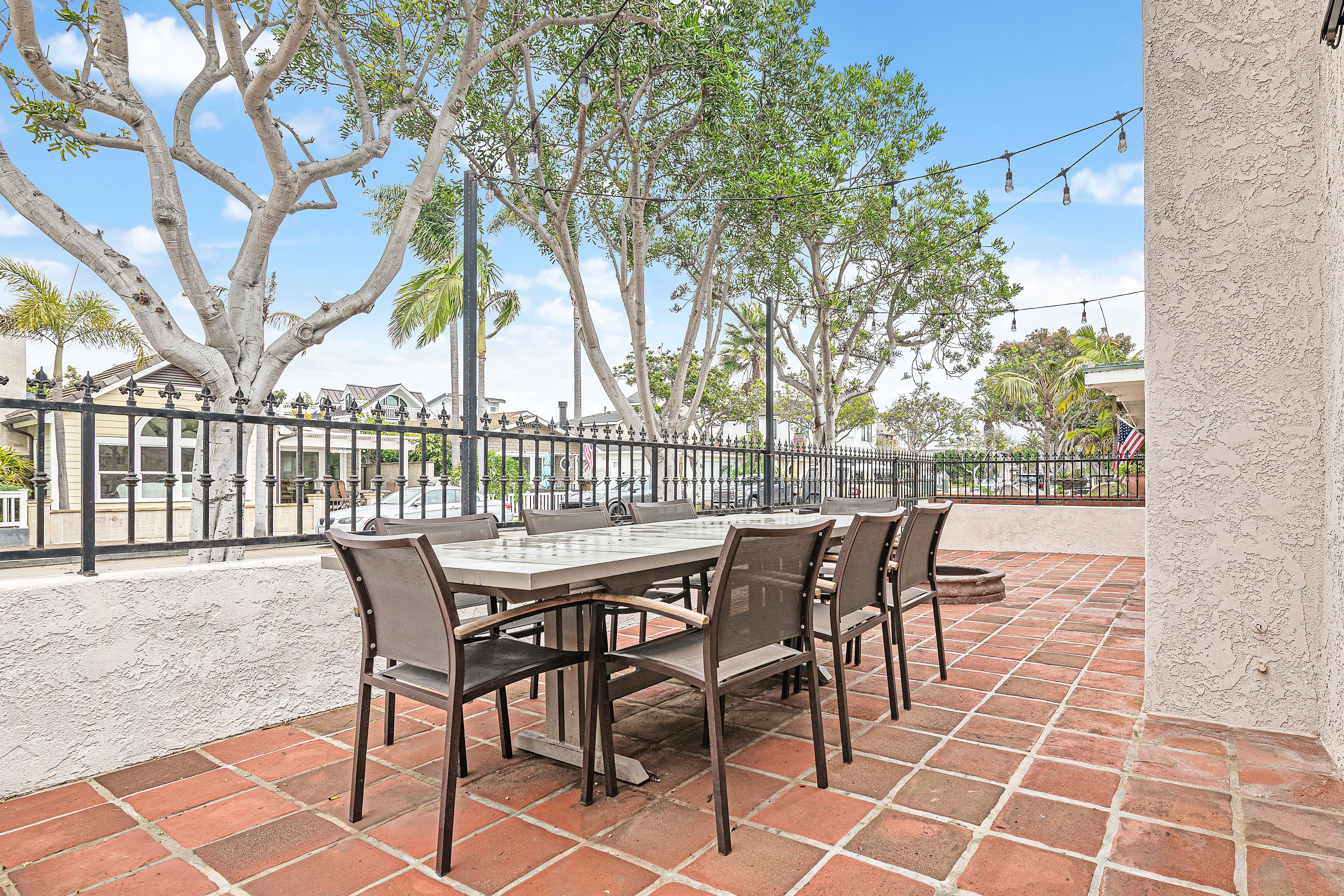 Gather outdoors on the front patio, offering seating for eight and a relaxed setting for meals