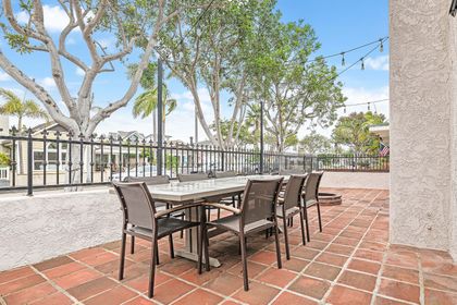 Gather outdoors on the front patio, offering seating for eight and a relaxed setting for meals
