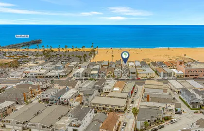 Aerial view just steps from the shoreline, with Newport’s vibrant coast at your doorstep