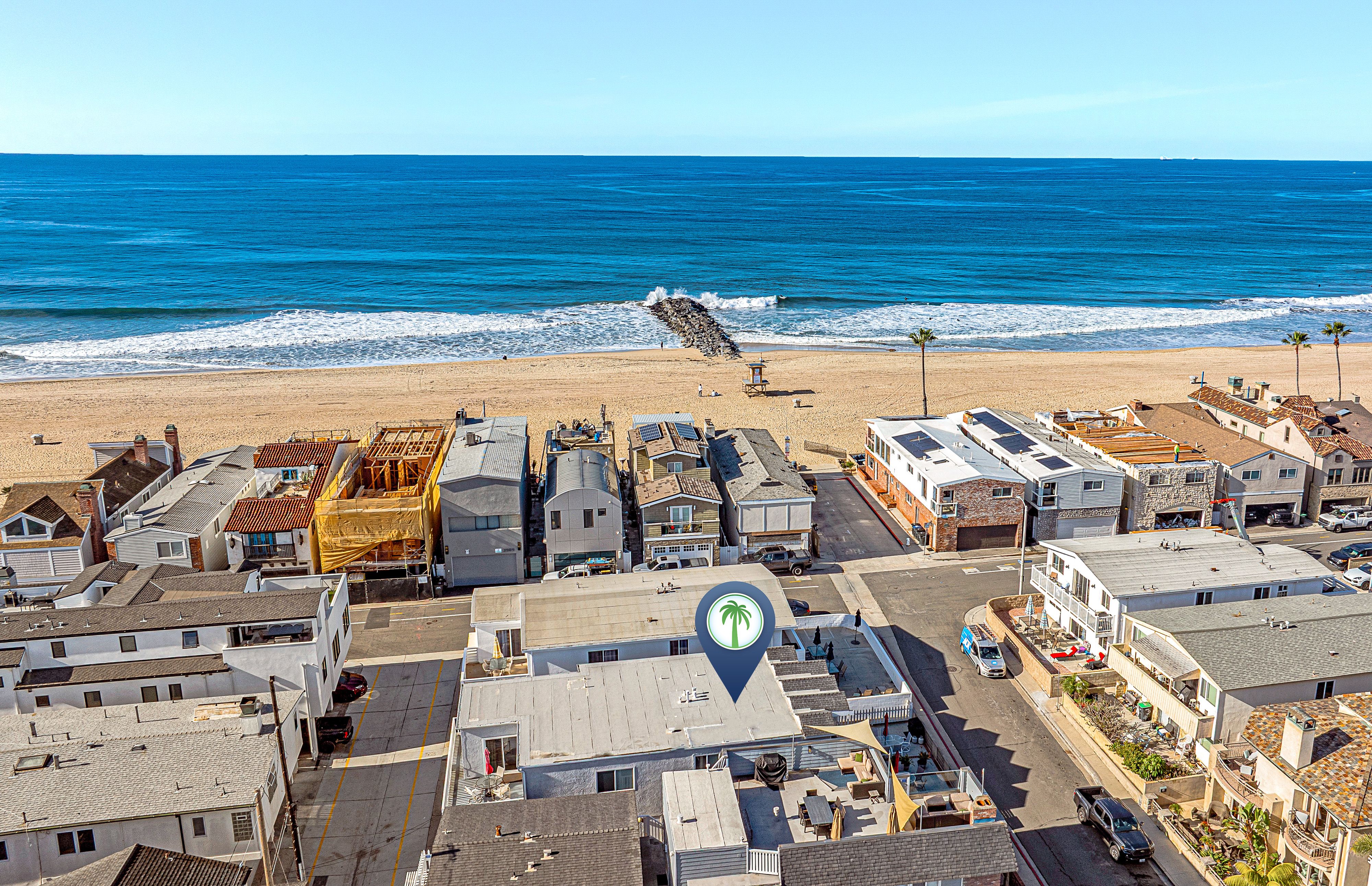 Located just steps from the sand on the Balboa Peninsula, with the beach right across the street