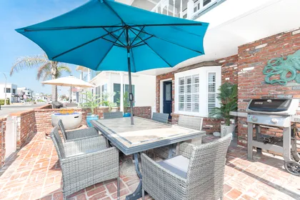 Stylish outdoor dining patio with ocean air, perfect for relaxed coastal evenings