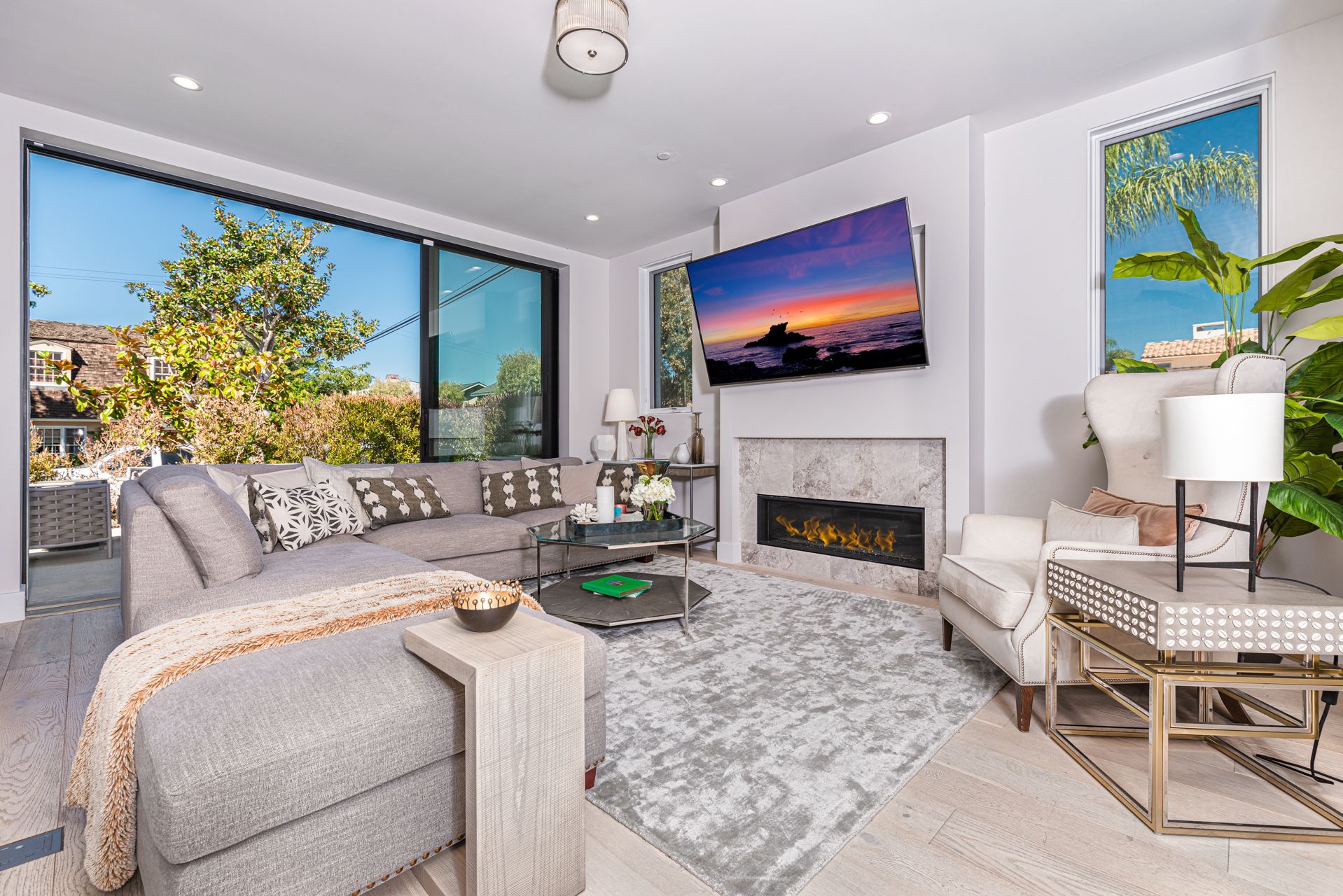 The living room seamlessly opens to the front patio for that wonderful indoor/outdoor lifestyle.