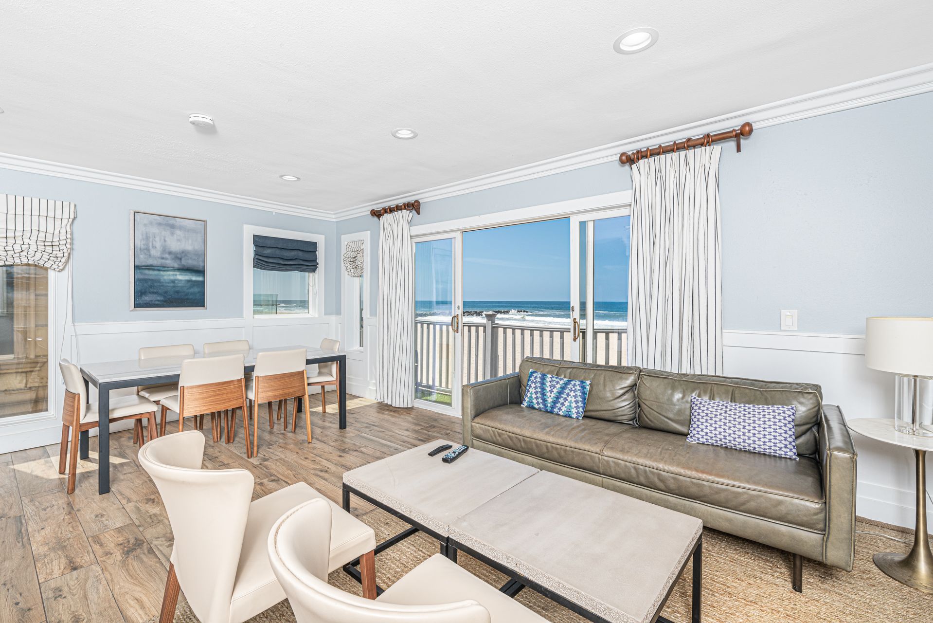 The main living area's open floor plan, which includes living/dining/kitchen areas, makes for easy group hangouts with an ocean view backdrop.
