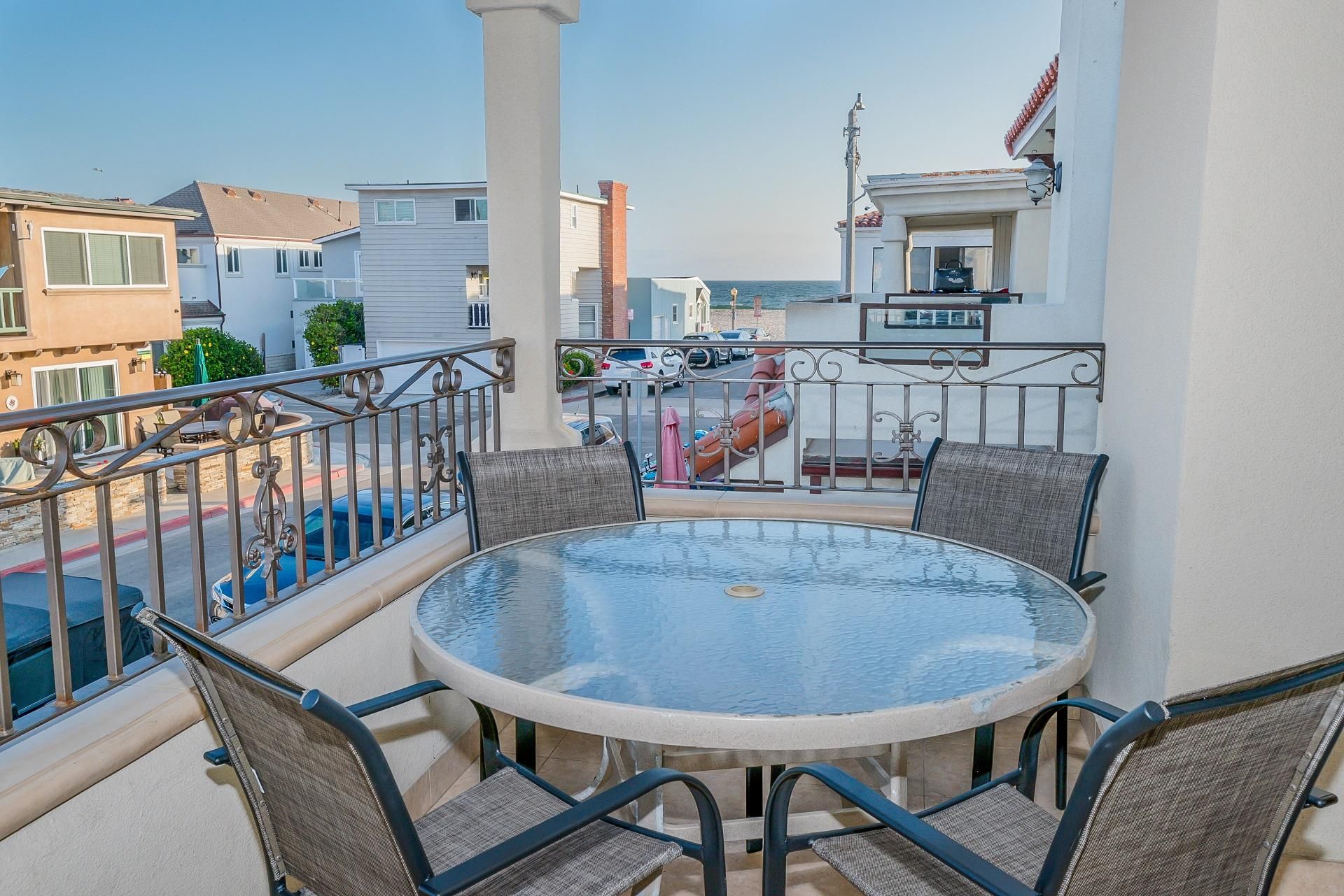 Ocean views and breezes can be enjoyed from the second level front balcony, with outdoor dining, extra seating and propane BBQ grill.