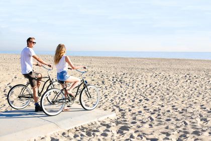 Cruise the oceanfront boardwalk on bike - by far the best way to see Newport!