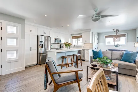 The kitchen opens seamlessly into the living and dining area for easy group hangouts.