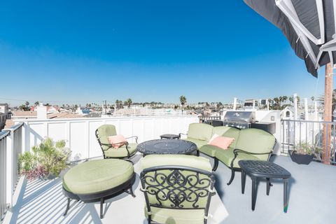 The glorious rooftop deck includes ample seating, propane BBQ grill, propane fire pit, and fresh ocean breezes.