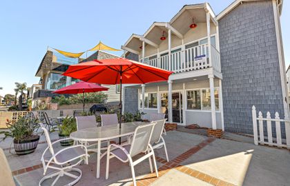 Oversized front ocean view patio is shared with downstairs unit. However, each unit has its own designated BBQ grill and outdoor dining table, seating and umbrella.