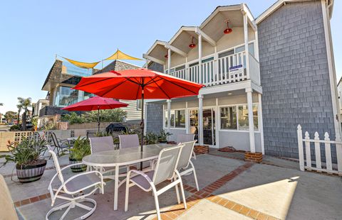 Oversized front ocean view patio is shared with downstairs unit. However, each unit has its own designated BBQ grill and outdoor dining table, seating and umbrella.