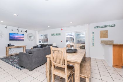 Beyond the living area is the dining area with table and seating for 6.
